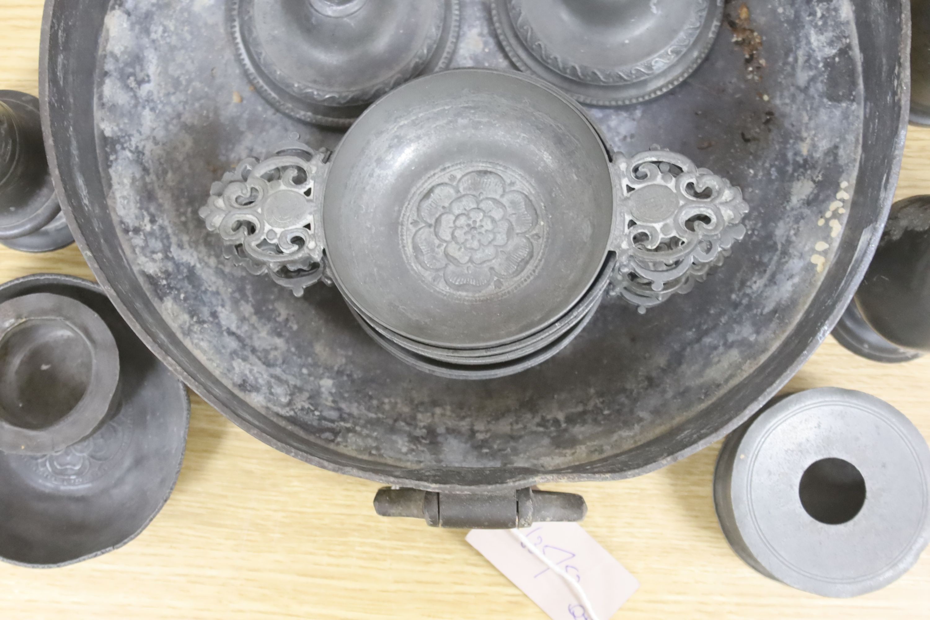 A collection of Dutch antique pewter, including two-handled bowl, wine taster, measures, etc.